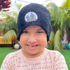 Child wearing the black beanie