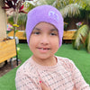 child wearing the purple beanie