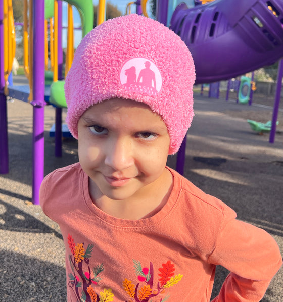 child wearing the pink beanie