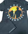 Black tshirt back side laid out on a table with another tshirt showing the front folded on top of it