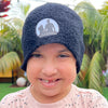 child wearing black beanie with white logo
