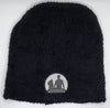Black beanie with white logo on a white background