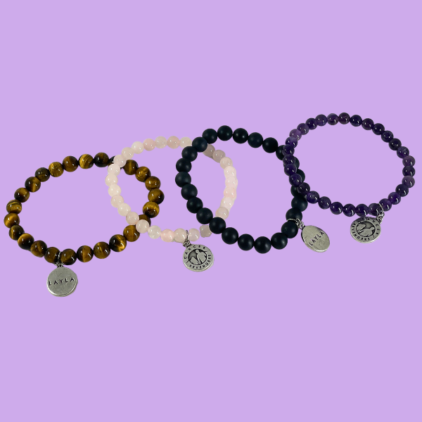  all four bracelet options together. Amethyst, black agate, rose quartz and tiger's eye