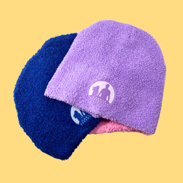 Pink, blue and purple beanies stacked together