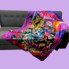 Cancer revengers fleece superhero blanket spread out on a couch