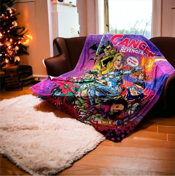 Cancer revengers superhero blanket spread out on a couch with a christmas tree behind it