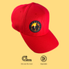 Red adjustable baseball cap with colored sunset logo, one size fits most
